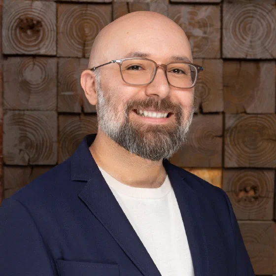 Tony Castillo, founder of WISLR.ai, beside his name and the WISLR.ai lockup on a press sheet