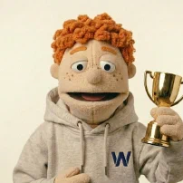 Carl holding up a gold trophy