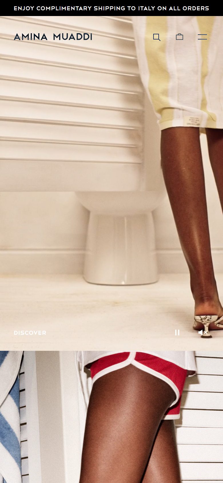 Amina Muaddi homepage on mobile, Shopify luxury footwear storefront captured at 390 x 844